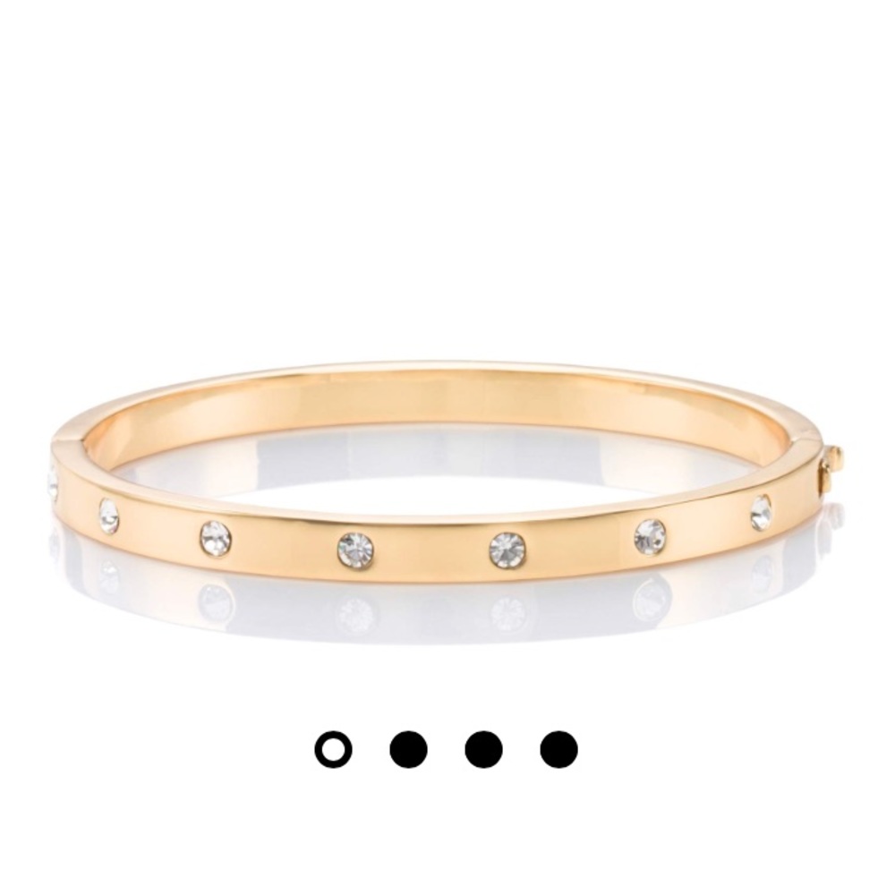 Kate Spade “Set in Stone Hinged Bangle” in gold